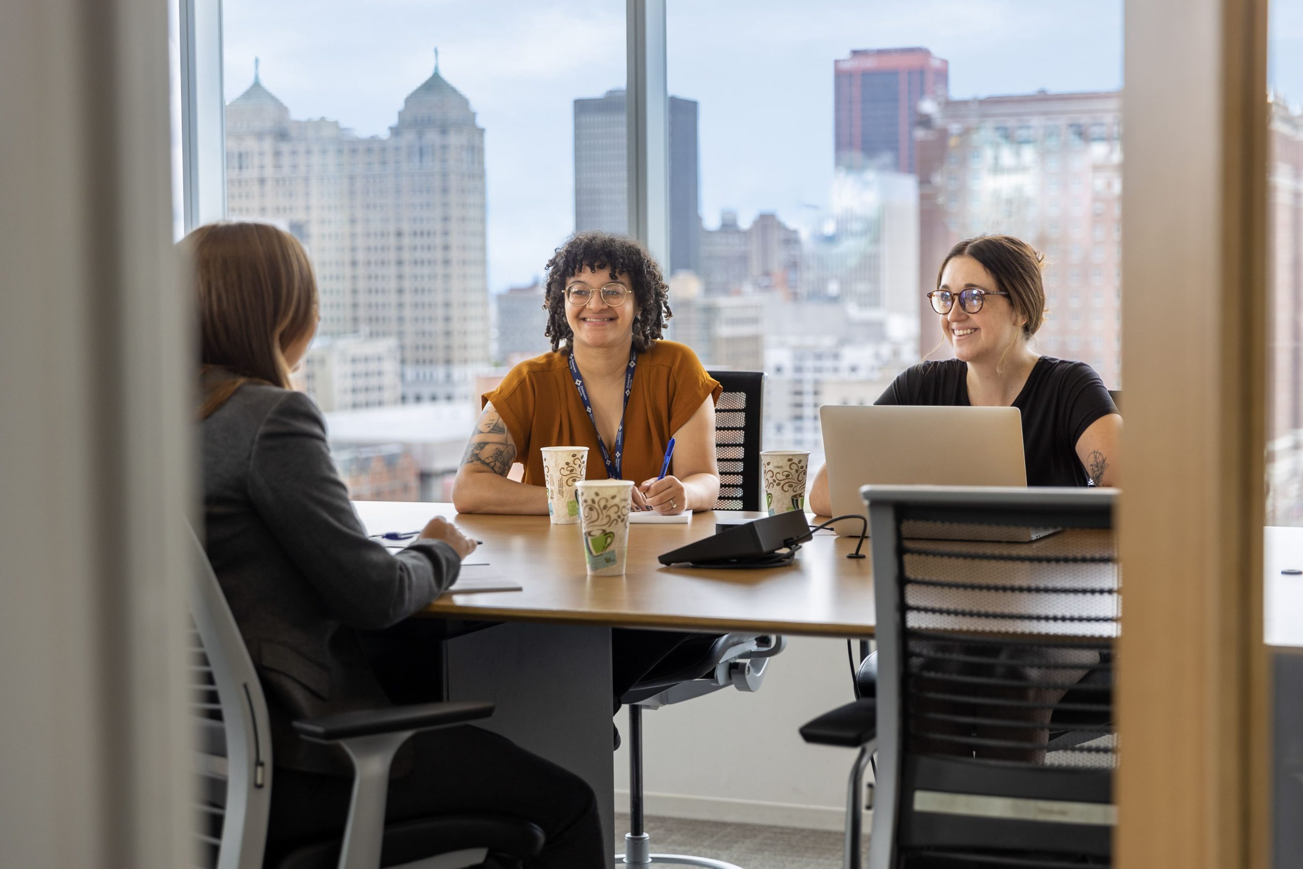 Headquarters (HQ) team members having a meeting in the conference room