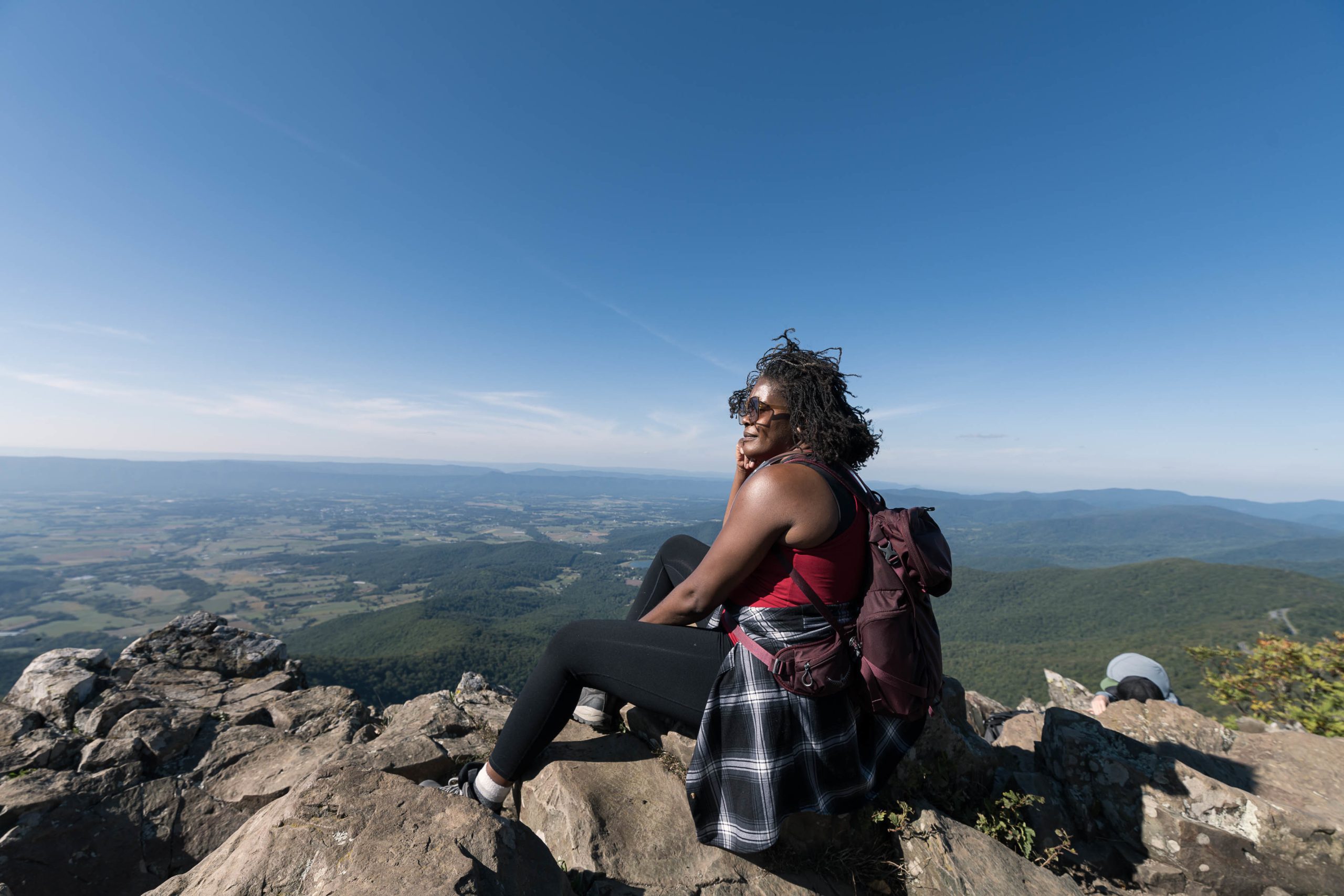 Hiker sitting admiring the view of Shenandoah National Park